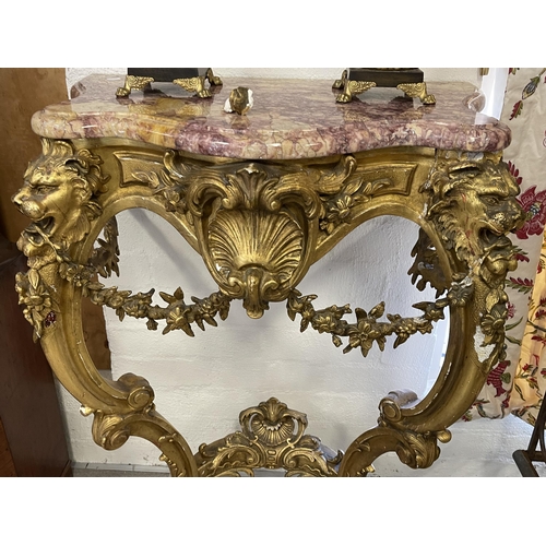 2 - Antique 19th century marble topped gilt console, the legs cast in high relief with lions heads, appl... 