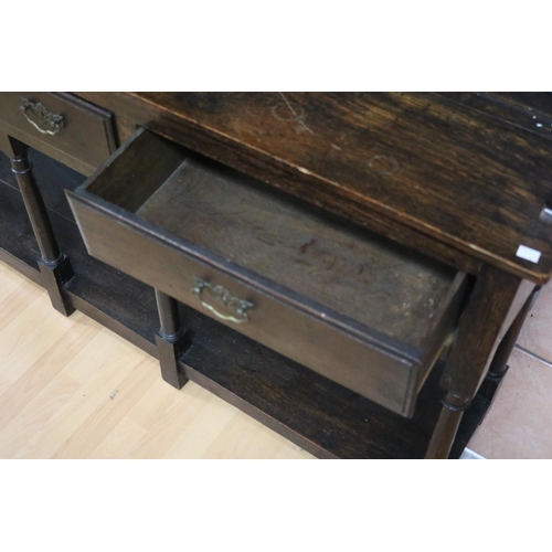 80 - Antique English 18th century revival oak pot board dresser, fitted with three drawers, with turned b... 
