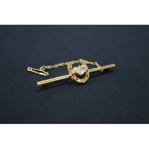 1125 - 18ct gold and diamond horse shoe brooch with safety chain, approx 5.2cm W and approx total weight 5 ... 