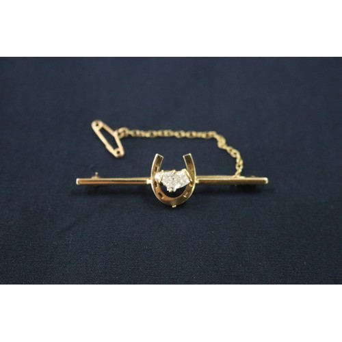 1125 - 18ct gold and diamond horse shoe brooch with safety chain, approx 5.2cm W and approx total weight 5 ... 