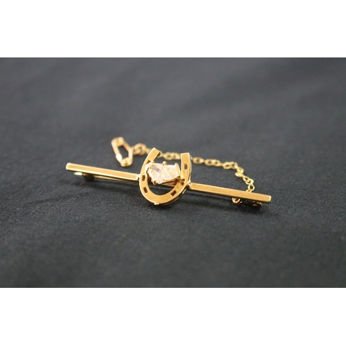 1125 - 18ct gold and diamond horse shoe brooch with safety chain, approx 5.2cm W and approx total weight 5 ... 