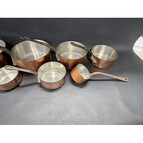 97 - Good set of eight French (Tournus) copper saucepans of graduating size, to include a long handled sa... 