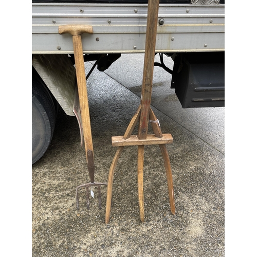 381 - Old European oak pitch fork approx 176 cm long, along with an antique iron and wood garden fork (2)