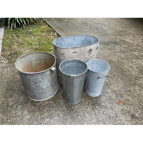384 - Four metal buckets, one is antique, remainder new, approx 46cm H and shorter (4)