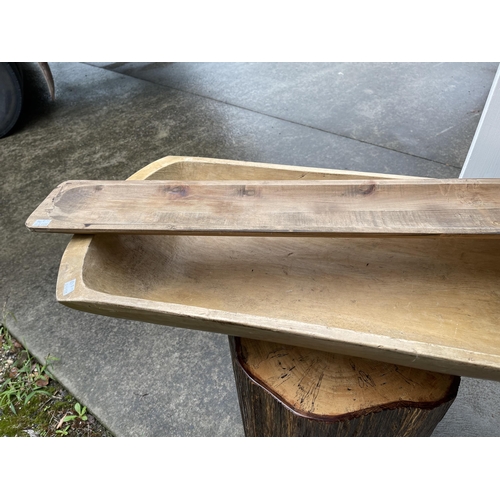 388 - Long European dug out food trough, showing some age, approx 94 cm long x 40 cm wide. Along with a ne... 