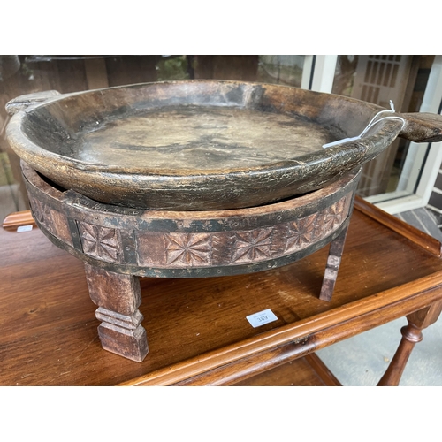 391 - Rustic Indian ? food tray and carved wood stand, approx 60 cm wide at handles
