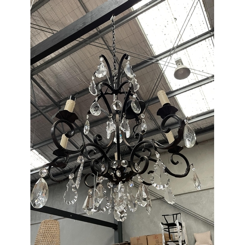 403 - French style wrought iron four light chandelier, with applied cut crystal drops