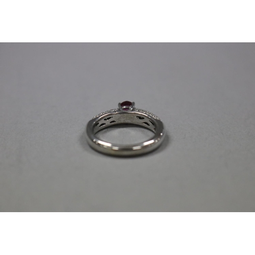 1248 - RETURNED 13/7/24 - Pave diamond and ruby dress ring set in 18ct white gold, Size K, as per valuation... 