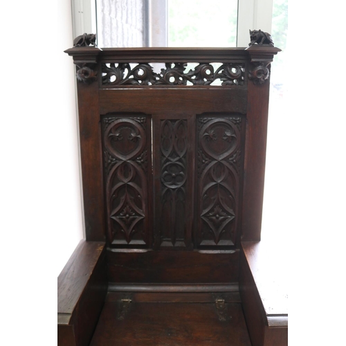 1042 - Antique French Gothic style hall chair, single lift up seat, carved in relief, carved linen fold pan... 