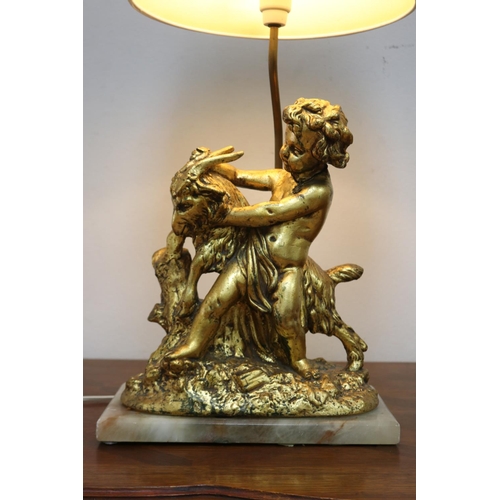 1135 - Figural gilt putto with goat lamp on marble base, with shade, working at time of inspection, approx ... 