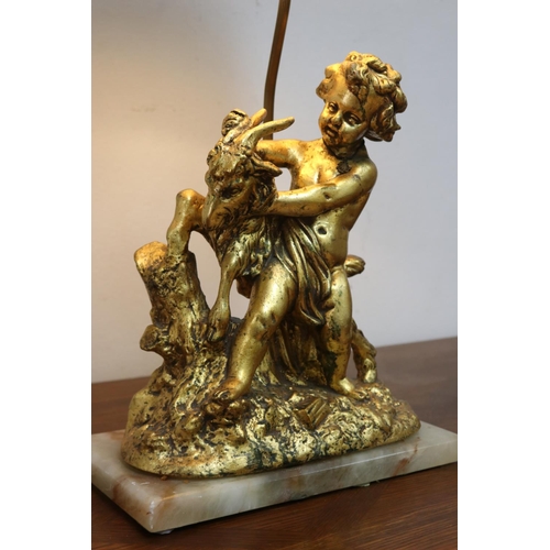 1135 - Figural gilt putto with goat lamp on marble base, with shade, working at time of inspection, approx ... 