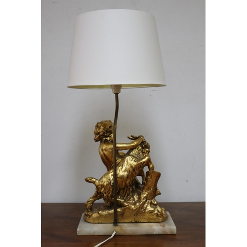 1135 - Figural gilt putto with goat lamp on marble base, with shade, working at time of inspection, approx ... 