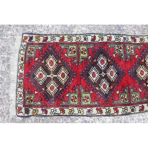 1158 - Persian handwoven wool carpet of red ground with three gulls to centre, 52cm x 107cm