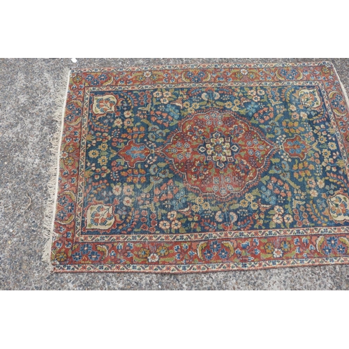 1165 - Persian handwoven wool carpet, central medallion, showing wear & age, approx 125.5cm x 177cm