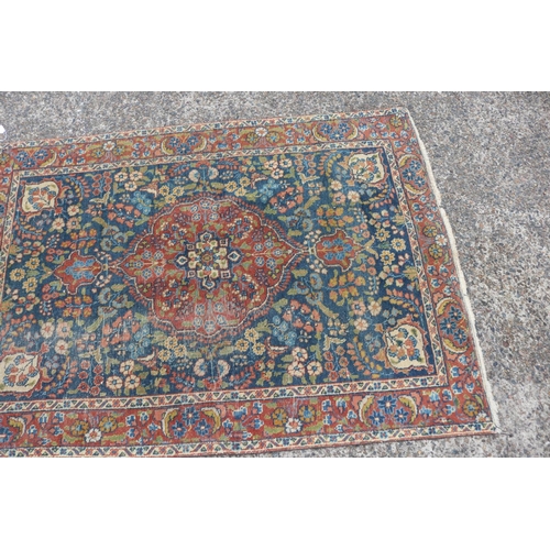 1165 - Persian handwoven wool carpet, central medallion, showing wear & age, approx 125.5cm x 177cm
