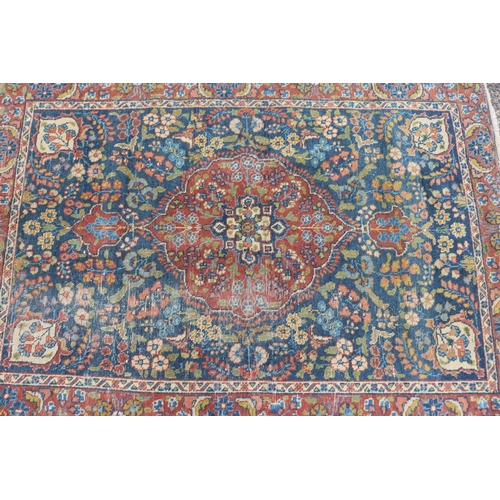 1165 - Persian handwoven wool carpet, central medallion, showing wear & age, approx 125.5cm x 177cm