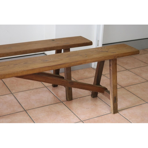 1208 - Pair of French wooden benches with trestle ends, approx 202cm L x 20cm W x 46cm H (2)