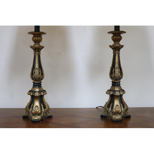 1209 - Pair of decorative black and gilt table lamps, cream shantung shades, in working order at the time o... 