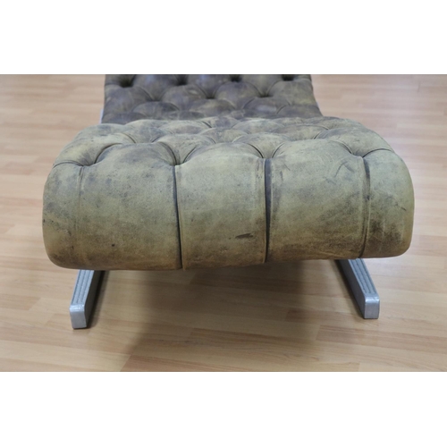 1001 - Rare & unique aluminum based leather Art Deco chaise lounge of S form, the base cast with floral mot... 