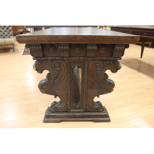 1218 - Antique French Henri II desk standing on a stretcher base, carved griffin terms to either end, appro... 