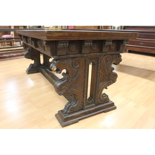 1218 - Antique French Henri II desk standing on a stretcher base, carved griffin terms to either end, appro... 