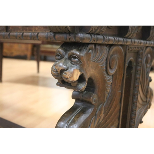 1218 - Antique French Henri II desk standing on a stretcher base, carved griffin terms to either end, appro... 