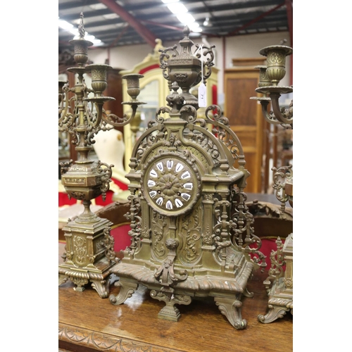 1302 - Antique French bronze mantle clock and garnitures, in the Renaissance revival style, no key, has pen... 