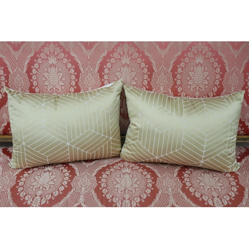 1242 - Two gold and cream geometric oblong cushions by Darren Palmer, approx 48cm x 31cm (2)