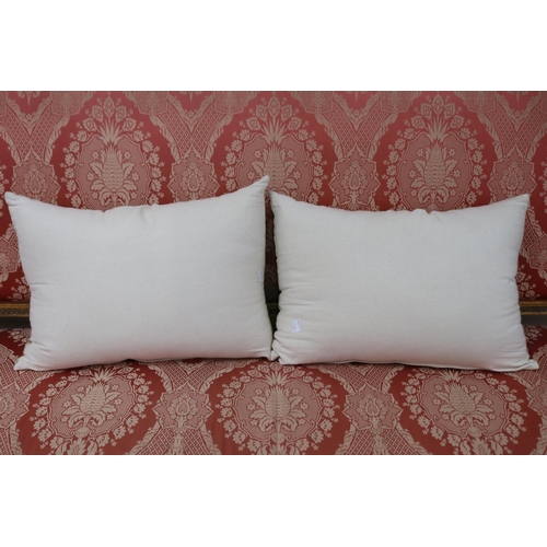 1242 - Two gold and cream geometric oblong cushions by Darren Palmer, approx 48cm x 31cm (2)