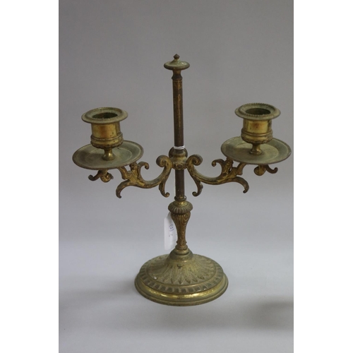 1113 - Pair of French brass two light candlesticks, standing on heavy cast base, approx 25cm H x 21cm W (2)