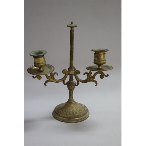 1113 - Pair of French brass two light candlesticks, standing on heavy cast base, approx 25cm H x 21cm W (2)