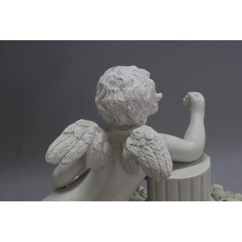 1170 - F. KESSLER (1792-1882) bisque porcelain figure of a putto holding torch, against a pedestal, signed ... 