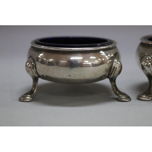 1178 - Pair of antique 18th century hallmarked sterling silver salts with blue glass liner, London, total a... 