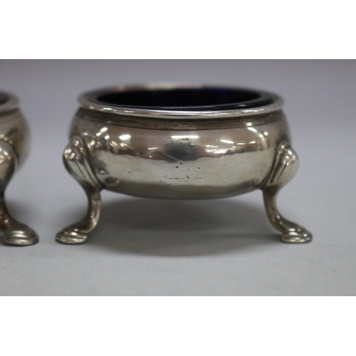 1178 - Pair of antique 18th century hallmarked sterling silver salts with blue glass liner, London, total a... 