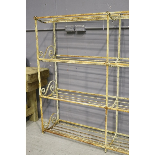 1065 - French wrought iron multi tiered rack, with scrolling ends, approx 171cm L x 36.5cm W x 142cm H