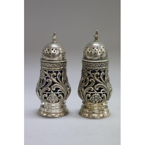 1257 - Antique cruet set consisting of three sterling silver salts along with two pepper pots, Birmingham 1... 