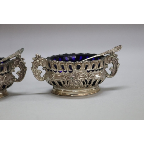 1257 - Antique cruet set consisting of three sterling silver salts along with two pepper pots, Birmingham 1... 