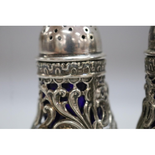 1257 - Antique cruet set consisting of three sterling silver salts along with two pepper pots, Birmingham 1... 