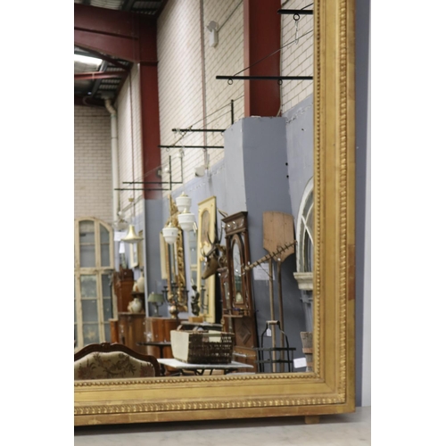 1058 - Antique French gilt salon mirror, with central laurel crest, quiver & torche, approx 183cm x 97cm