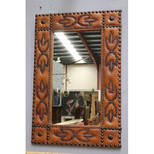 1336 - Unusual pressed leather wall mirror with studs, approx 90cm H x 61cm W