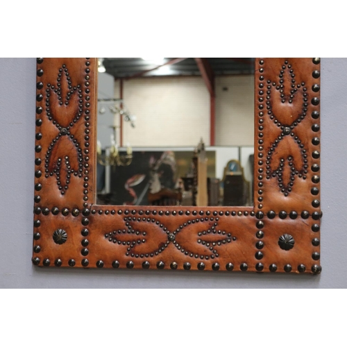 1336 - Unusual pressed leather wall mirror with studs, approx 90cm H x 61cm W