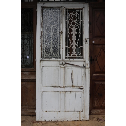 428 - French Art Deco entry door, with scrolling iron panels, has lock (in office C143.262), approx 207cm ... 