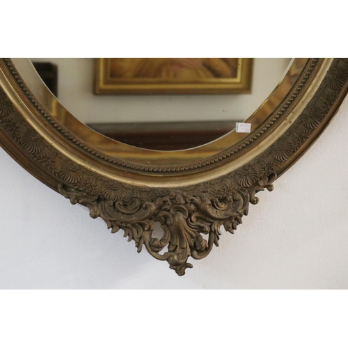 1095 - Antique French Louis XV style gilt framed oval wall mirror with C scroll crest to top, approx 122cm ... 