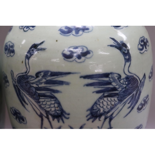 1017 - Pair of antique Chinese lidded celadon glaze urns, with blue storks, bats and fruit on rosewood stan... 