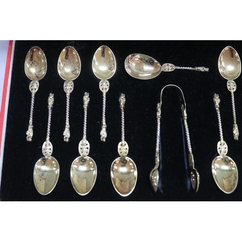 1266 - Cased thirteen Victorian hallmarked sterling silver apostle spoons along with a pair of tongs, Londo... 