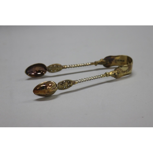 1266 - Cased thirteen Victorian hallmarked sterling silver apostle spoons along with a pair of tongs, Londo... 