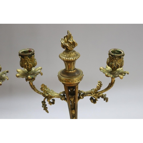 1326 - Pair of antique French Louis XVI revival bronze two stick candelabra, each with central flaming torc... 