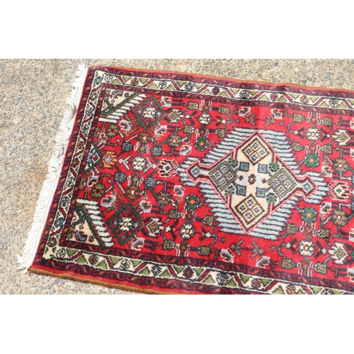 1415 - Persian hand knotted wool carpet, approx 64cm x 104cm