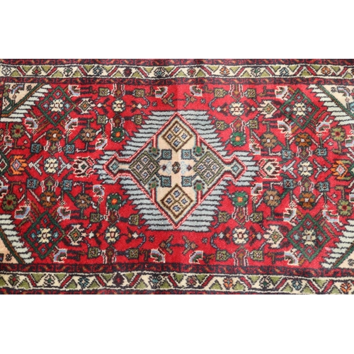 1415 - Persian hand knotted wool carpet, approx 64cm x 104cm