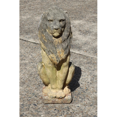 440 - Composite stone lion garden statute, approx 63cm H x 24cm W x 28cm D